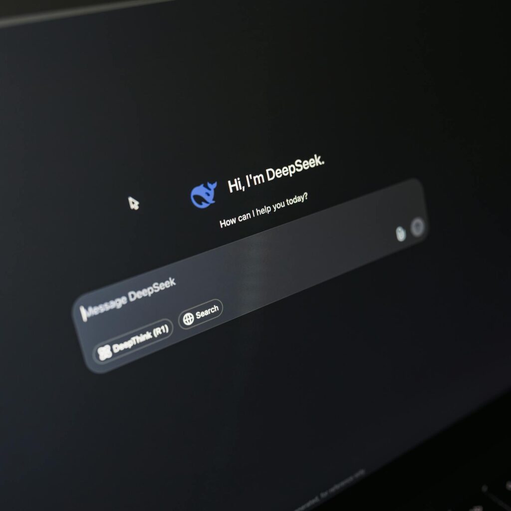 Close-up of a laptop screen displaying an AI chatbot interface with a dark theme.